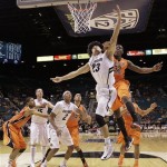 Colorado's Sabatino Chen (23) shoots against Oregon State's Jarmal Reid in the first half during a Pac-12 tournament NCAA college basketball game on Wednesday, March 13, 2013, in Las Vegas. Colorado won 74-68. (AP Photo/Julie Jacobson)