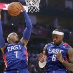 East Team's Carmelo Anthony of the New York Knicks (7) and LeBron James come down after a rebound against the West Team during the first half of the NBA All-Star basketball game Sunday, Feb. 17, 2013, in Houston. (AP Photo/Eric Gay)