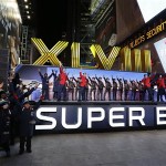 Performers, including the Boys Choir of Harlem, Jersey Boys and the Rockettes perform as the Roman numerals for Super Bowl XLVIII rise during an unveiling ceremony along Super Bowl Boulevard Wednesday, Jan. 29, 2014, in New York. The Seattle Seahawks are scheduled to play the Denver Broncos in the NFL Super Bowl XLVIII football game on Sunday, Feb. 2, in East Rutherford, N.J. (AP Photo/Julio Cortez)