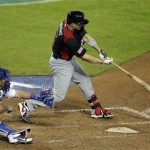 United States's David Wright hits a grand slam during the fifth inning of a World Baseball Classic game against Italy Saturday, March 9, 2013, in Phoenix. (AP Photo/Charlie Riedel)
