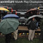 Fans take shelter under umbrellas as snow falls during the Match Play Championship golf tournament, Wednesday, Feb. 20, 2013, in Marana, Ariz. Play was suspended. (AP Photo/Ross Franklin)