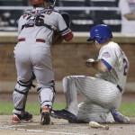 New York Mets' Anthony Recker is tagged out by Arizona Diamondbacks catcher Miguel Montero during the seventh inning of a baseball game Tuesday, July 2, 2013, in New York. (AP Photo/Frank Franklin II)