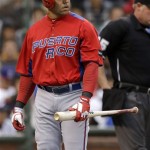 Puerto Rico's Carlos Beltran walks to the dugout after striking out against the Dominican Republic's Samuel Deduno during the first inning of the championship game of the World Baseball Classic in San Francisco, Tuesday, March 19, 2013. (AP Photo/Eric Risberg)
