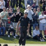 Phil Mickelson reacts to the crowd after missing a birdie putt on the ninth green during the first round of the Waste Management Phoenix Open golf tournament, Thursday, Jan. 31, 2013, in Scottsdale, Ariz. (AP Photo/Matt York)