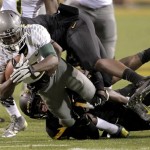 Oregon running back De'Anthony Thomas (6) is tackled by Arizona State safety Alden Darby during the first half of an NCAA college football game, Thursday, Oct. 18, 2012, in Tempe, Ariz. (AP Photo/Matt York)