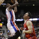 Los Angeles Clippers guard J.J. Redick, right, grimaces after being kicked in the stomach by Detroit Pistons guard Rodney Stuckey during the first half of an NBA basketball game in Auburn Hills, Mich., Monday, Jan. 20, 2014. (AP Photo/Carlos Osorio)