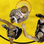 Miami Heat power forward Chris Andersen (11) dunks the ball as San Antonio Spurs center Boris Diaw (33) of France and San Antonio Spurs center Tiago Splitter (22) of Brazil look on during the first half of Game 2 in the NBA Finals basketball game, Sunday, June 9, 2013 in Miami. (AP Photo/Mike Segar, Pool)