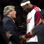 Miami Heat owner Mickey Arison, left, presents LeBron James with his 2012 NBA Finals championship ring during a ceremony before a basketball game against the Boston Celtics, Tuesday, Oct. 30, 2012, in Miami. (AP Photo/J Pat Carter)