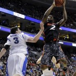 Cincinnati's Titus Rubles, right, goes up for a shot against Creighton's Doug McDermott during the first half of a second-round game of the NCAA college basketball tournament, Friday, March 22, 2013, in Philadelphia. (AP Photo/Matt Slocum)