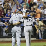 American League's Mariano Rivera, of the New York Yankees, is congratulated by catcher Salvador Perez, left, of the Kansas City Royals, after the eighth inning of the MLB All-Star baseball game, on Tuesday, July 16, 2013, in New York. (AP Photo/Matt Slocum)