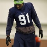 Seattle Seahawks defensive end Chris Clemons warms up at the start of NFL football practice Thursday, Jan. 30, 2014, in East Rutherford, N.J. The Seahawks and the Denver Broncos are scheduled to play in the Super Bowl XLVIII football game Sunday, Feb. 2, 2014. (AP Photo)