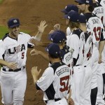 United States' David Wright (5) high fives teammates during the player introductions before the start of a second round World Baseball Classic game against Puerto Rico, Tuesday, March 12, 2013 in Miami. The U.S. defeated Puerto Rico 7-1. (AP Photo/Wilfredo Lee)