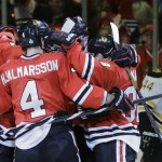 The Chicago Blackhawks celebrate a second period goal against the Boston Bruins during Game 5 of the NHL hockey Stanley Cup Finals, Saturday, June 22, 2013, in Chicago. (AP Photo/Nam Y. Huh)
