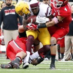 Arizona State wide receiver Gerell Robinson, center, loses his helmet in a tackle by Utah linebackers Chaz Walker (32) and Brian Blechen (4) during the second half of an NCAA college football game, Saturday, Oct. 8, 2011, in Salt Lake City. Arizona State won 35-14. (AP Photo/Jim Urquhart)