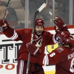 Phoenix Coyotes center Daymond Langkow, left, is congratulated by teammate David Schlemko (6) after Langkow scored the game-winning goal against the Los Angeles Kings in the overtime period of an NHL hockey game Saturday, Oct. 29, 2011, in Glendale, Ariz. The Coyotes won 3-2. (AP Photo/Paul Connors)
