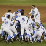 UCLA players celebrate deafeating Mississippi State 8-0 to win the championship in Game 2 of the NCAA College World Series baseball finals, Tuesday, June 25, 2013, in Omaha, Neb. (AP Photo/Nati Harnik)
