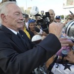Dallas Cowboys owner Jerry Jones signs his autograph before the induction ceremony at the Pro Football Hall of Fame Saturday, Aug. 3, 2013, in Canton, Ohio. (AP Photo/David Richard)
