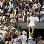 Andy Murray of Britain is applauded after he celebrated his victory against Novak Djokovic of Serbia with relatives and friends following the Men's singles final match at the All England Lawn Tennis Championships in Wimbledon, London, Sunday, July 7, 2013. (AP Photo/Anja Niedringhaus, Pool)
