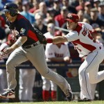 United States' David Wright, left, gets tagged out during a rundown by Canada's Taylor Green as Wright tries to score a run in the second inning during a World Baseball Classic baseball game on Sunday, March 10, 2013, in Phoenix. (AP Photo/Ross D. Franklin)