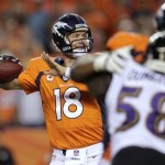 Denver Broncos quarterback Peyton Manning (18) looks to throw against the Baltimore Ravens during the first half of an NFL football game, Thursday, Sept. 5, 2013, in Denver. (AP Photo/Joe Mahoney)