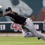 Pittsburgh Pirates left fielder Starling Marte makes a diving catch on a ball hit by St. Louis Cardinals' Matt Carpenter in the third inning Game 5 of a National League baseball division series on Wednesday, Oct. 9, 2013, in St. Louis. (AP Photo/Charlie Riedel)