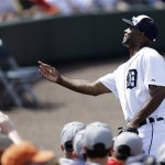 Detroit Tigers right fielder Torii Hunter tosses a ball to a fan during the third inning of an exhibition spring training baseball game against the Atlanta Braves, Wednesday, Feb. 27, 2013, in Lakeland, Fla. (AP Photo/Charlie Neibergall)