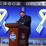 Former New England Patriots guard Joe Andruzzi, who assisted in rescuing in rescue an injured victim from the Boston Marathon attack, honors the victims and first responders of the bombings during the first round of the NFL football draft, Thursday, April 25, 2013 at Radio City Music Hall in New York. (AP Photo/Jason DeCrow)