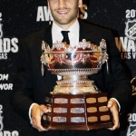 Boston Bruins' Patrice Bergeron poses with the Selks Trophy after winning the award for best defensive forward during the NHL Awards, Wednesday, June 20, 2012, in Las Vegas. (AP Photo/Julie Jacobson)