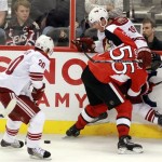 Ottawa Senators' Sergei Gonchar (55) checks Phoenix Coyotes' Shane Doan (19) as Coyotes' Eric Belanger takes the puck along the boards during second period NHL hockey action in Ottawa Tuesday, Oct. 26, 2010. (AP Photo/The Canadian Press, Fred Chartrand)