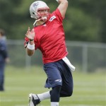 New England Patriots quarterback Tim Tebow throws during a NFL football practice in Foxborough, Mass., Tuesday June 11, 2013. (AP Photo/Charles Krupa)