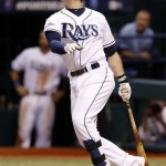 Tampa Bay Rays third baseman Evan Longoria watches as he hits a home run in the fifth inning to even the score in Game 3 of an American League baseball division series against the Boston Red Sox, Monday, Oct. 7, 2013, in St. Petersburg, Fla. (AP Photo/Mike Carlson)