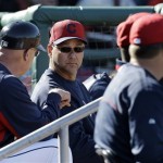 Cleveland Indians manager Terry Francona, center, talks with third base coach Brad Mills during an exhibition spring training baseball game against the Cincinnati Reds in Goodyear, Ariz., Friday, Feb. 22, 2013. (AP Photo/Paul Sancya)