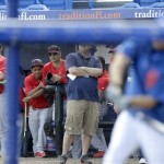 St. Louis Cardinals players look on as New York Mets first baseman Ike Davis, right, takes batting practice before an exhibition spring training baseball game, Wednesday, Feb. 27, 2013, in Port St. Lucie, Fla. (AP Photo/Julio Cortez)