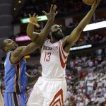 Houston Rockets' James Harden (13) is fouled by Oklahoma City Thunder's Serge Ibaka (9) during the fourth quarter of Game 3 in a first-round NBA basketball playoff series Saturday, April 27, 2013, in Houston. The Thunder beat the Rockets 104-101. (AP Photo/David J. Phillip)