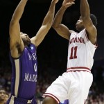 Indiana guard Kevin Ferrell (11) drives against James Madison guard A.J. Davis in the first half of a second-round game at the NCAA college basketball tournament, Friday, March 22, 2013, in Dayton, Ohio. (AP Photo/Al Behrman)