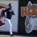 Detroit Tigers pitcher Rick Porcello runs in the outfield before a baseball spring training exhibition game against the Toronto Blue Jays, Wednesday, March 6, 2013, in Lakeland, Fla. (AP Photo/Charlie Neibergall)