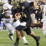 Baylor quarterback Bryce Petty (14) runs in for a touchdown against Central Florida during the second half of the Fiesta Bowl NCAA college football game, Wednesday, Jan. 1, 2014, in Glendale, Ariz. (AP Photo/Ross D. Franklin)