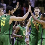Oregon players celebrate on the court during the second half of a second-round game in the NCAA college basketball tournament against Oklahoma State in San Jose, Calif., Thursday, March 21, 2013. Oregon won 68-55. (AP Photo/Ben Margot)