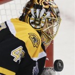 Boston Bruins goalie Tuukka Rask (40), of Finland, turns aside the puck against the Chicago Blackhawks during the first period in Game 4 of the NHL hockey Stanley Cup Finals, Wednesday, June 19, 2013, in Boston. (AP Photo/Charles Krupa)