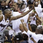 Miami Heat's Chris Bosh (1) celebrates after winning Game 7 of the NBA basketball championships against the San Antonio Spurs Friday, June 21, 2013, in Miami. The 95-88 win is Miami's second straight NBA championship.(AP Photo/Steve Mitchell, Pool)