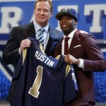 Tavon Austin, from West Virginia, stands with NFL Commissioner Roger Goodell after being selected eighth overall by the Saint Louis Rams in the first round of the NFL football draft, Thursday, April 25, 2013, at Radio City Music Hall in New York. (AP Photo/Jason DeCrow)