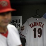 A jersey honoring the 19 firefighters who died in the wildfire in Yarnell, Ariz., hangs in the Arizona Diamondback's dugout before the baseball game against the New York Mets at Citi Field, Monday, July 1, 2013, in New York. (AP Photo/Seth Wenig)