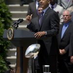 With the Vince Lombardi Super Bowl trophy in the foreground, President Barack Obama speaks on the South Lawn of the White House in Washington, Wednesday, June 5, 2013, during a ceremony honoring the Super Bowl XLVII champion Baltimore Ravens football team. The Ravens defeated the San Francisco 49ers in Super Bowl XLVII. (AP Photo/Evan Vucci)