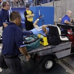 Tennessee Titans wide receiver Marc Mariani waves to fans as he is carried off the field after injuring his left leg returning a punt against the Arizona Cardinals in the first quarter of an NFL football preseason game on Thursday, Aug. 23, 2012, in Nashville, Tenn. (AP Photo/Wade Payne)