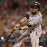 San Francisco Giants' Angel Pagan hits a triple during the third inning of Game 4 of baseball's National League championship series against the St. Louis Cardinals Thursday, Oct. 18, 2012, in St. Louis. (AP Photo/Jeff Roberson)