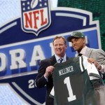 Dee Milliner, from Alabama, stands with NFL Commissioner Roger Goodell after being selected ninth overall by the New York Jets in the first round of the NFL football draft, Thursday, April 25, 2013, at Radio City Music Hall in New York. (AP Photo/Jason DeCrow)