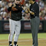 Baltimore Orioles manager Buck Showalter argues a call with umpire Alfonso Marquez during the second inning of a baseball game against the Arizona Diamondbacks, Monday, Aug. 12, 2013, in Phoenix. (AP Photo/Matt York)