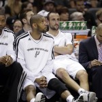 San Antonio Spurs' Tim Duncan and Manu Ginobili watch from the bench during the first half at Game 3 of the NBA Finals basketball series against the Miami Heat, Tuesday, June 11, 2013, in San Antonio. (AP Photo/Eric Gay)