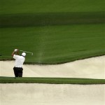 Angel Cabrera, of Argentina, hits out of a bunker on the eighth hole during the fourth round of the Masters golf tournament Sunday, April 14, 2013, in Augusta, Ga. (AP Photo/David J. Phillip)