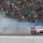 Kevin Harvick (29) smokes his tires in celebration after winning the AdvoCare 500 NASCAR Sprint Cup Series auto race at Phoenix International Raceway, Sunday, Nov. 10, 2013, in Avondale, Ariz. (AP Photo/Ralph Freso)